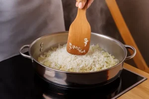 Onion and rice in a pan